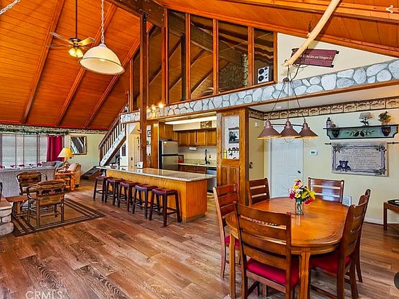 Open floor plan great room with generous dining and seating areas.
