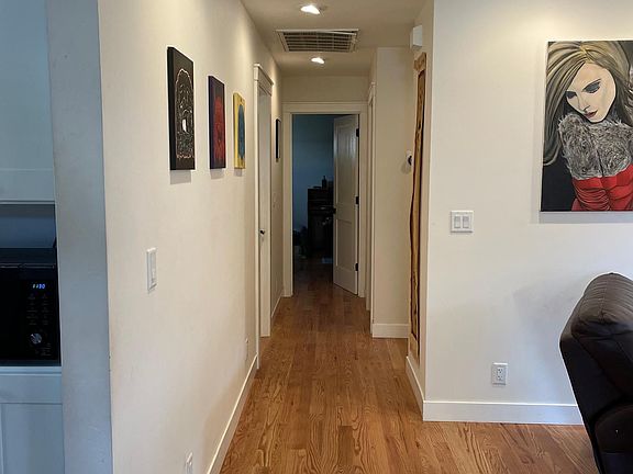 Master bedroom to the right of the hallway. Bedroom 1 to the left, bedroom 2 straight back.