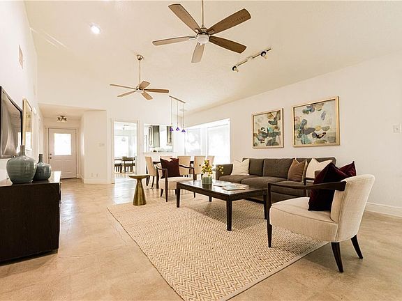 Vaulted ceilings and open floor plan with lots of natural light.