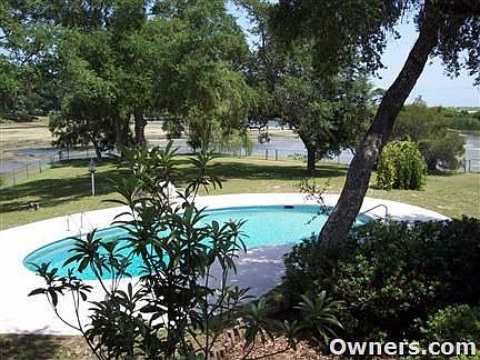 View of pool and lake from back deck.