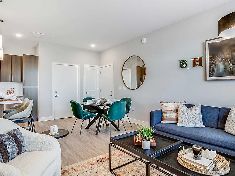 Bright, open living spaces blend contemporary finishes, comfortable gathering areas, and designer details to create a home that feels both stylish and inviting.