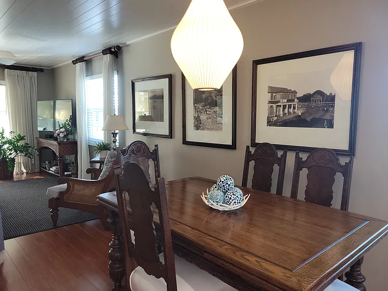 Dining area with expandable table to seat 8 Apartment contains tasteful artwork