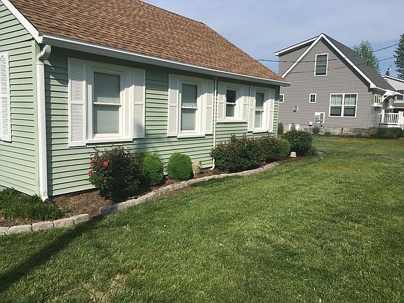STREET SIDE OF COTTAGE. BEDROOM,OFFICE, BATH, BEDROOM.