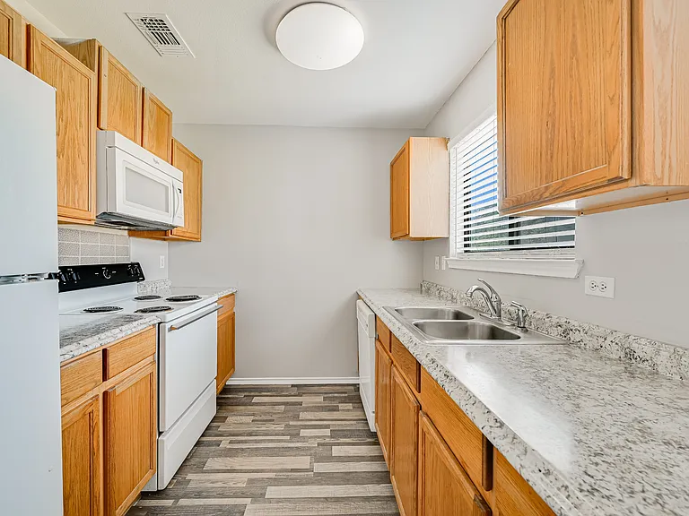 Modern updates with ample cabinet space and natural light.