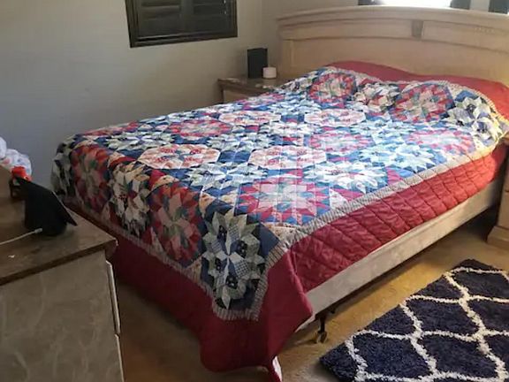 Downstairs bedroom with queen size bed