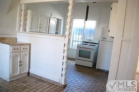 Open space between kitchen and dining area could be reconfigured