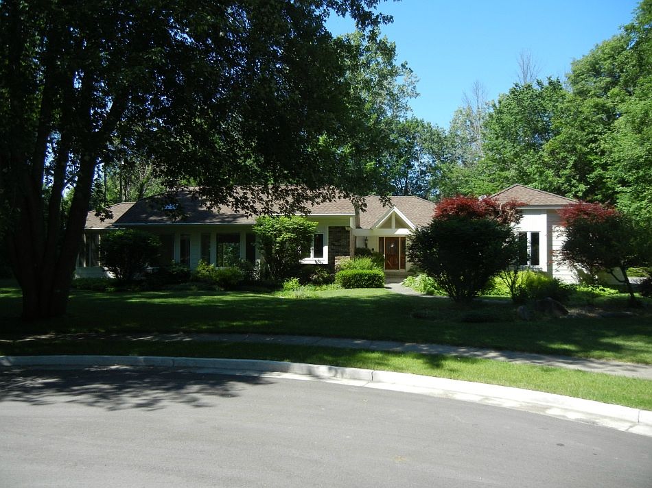 1st open this Saturday (6/25) 2-3 pm.  Style and Charm!  Contemporary ranch with vaulted ceilings on a private, one acre lot at the end of a cul-de-sac! Newer kitchen, with granite counter tops, stainless steel appliances and hardwood floors. Loaded with large windows and skylights!  Main floor laundry room, master and guest baths with heated tile floors. 2 furnaces, 2 hot water heaters. Security system, wine cellar, office and screened porch. Finished lower level with bedroom, kitchen, bath, 4th bedroom and den/5th bedroom option.  3.5 car garage, terrific landscaping and privacy!  So much to offer, call today!