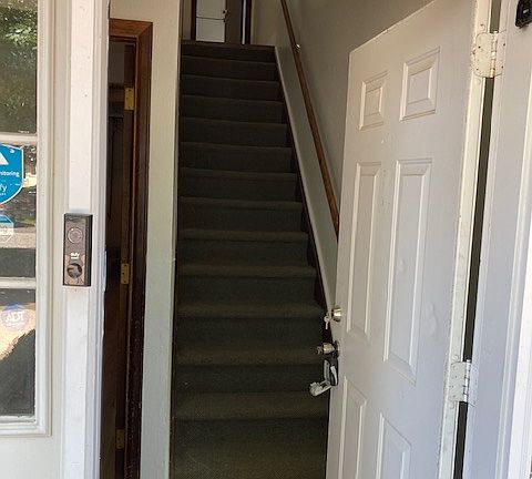 Front door leading to main floor staircase.