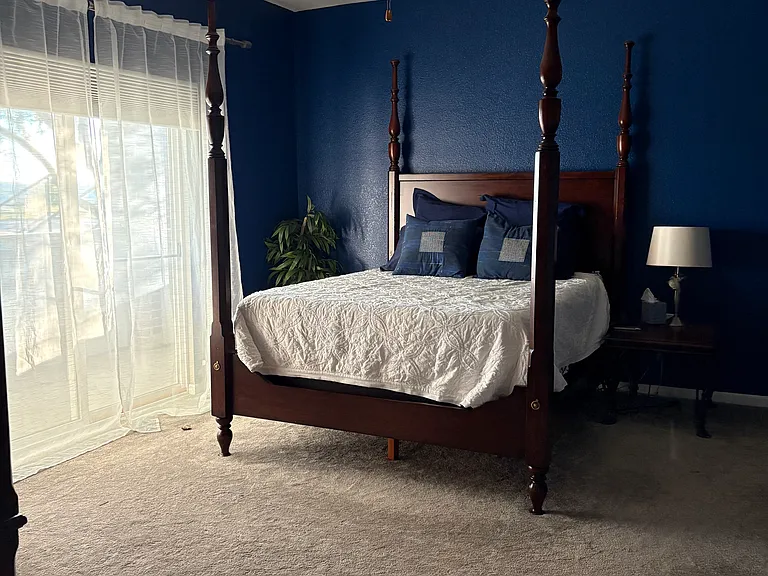 Spacious master bedroom with walkout patio