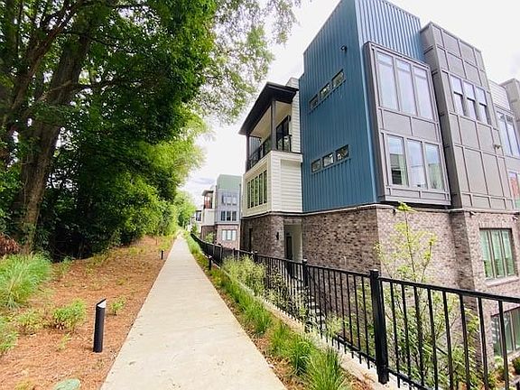 This sidewalk spans along the backside of the community and directly accesses the Southside Trail.