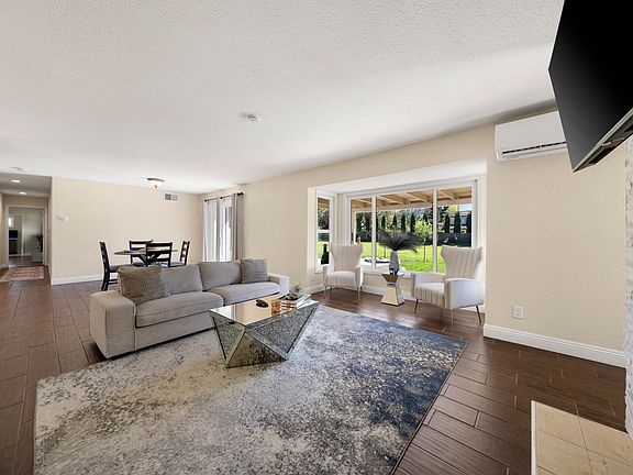 Living room with large windows and modern fireplace