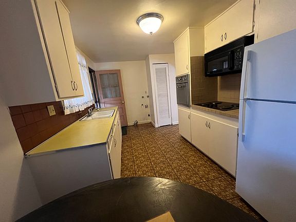 Kitchen. Washer / Dryer hook up for stack washer/ dryer by back door. Washer/ Dryer not included.