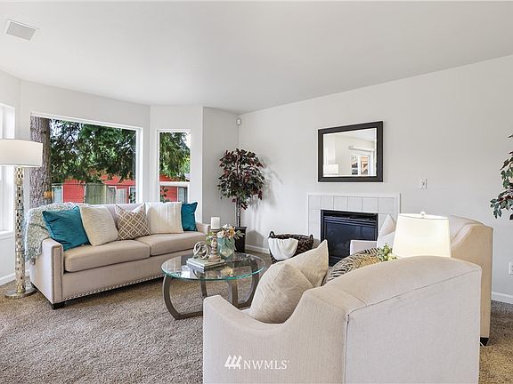 The living room features a bay window that allow lots of natural light. It also features a nice trim package, white vinyl windows and an easy-care, gas fireplace!