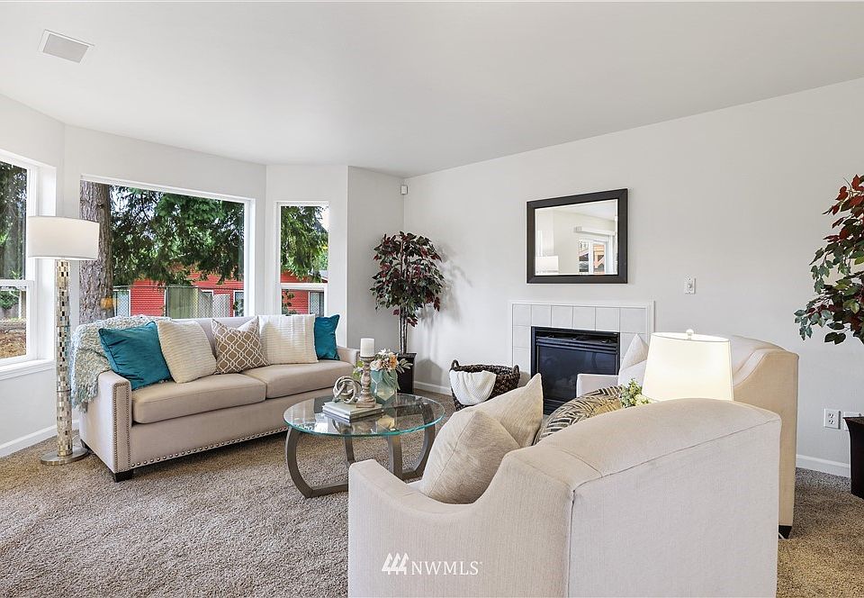 The living room features a bay window that allow lots of natural light. It also features a nice trim package, white vinyl windows and an easy-care, gas fireplace!
