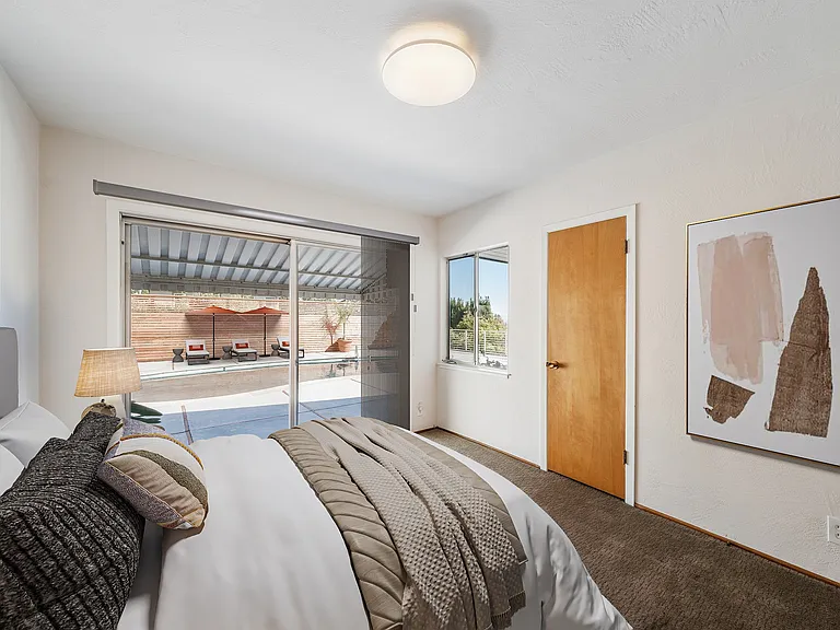 Staged Second Bedroom that opens to pool area.