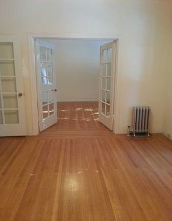french doors separate bedroom and living rooms