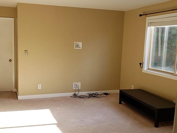 View of living room from door of second bedroom