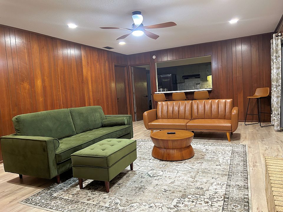 Family room adjacent to open kitchen with bar/counter and screened porch. Can easily accommodate large gatherings.