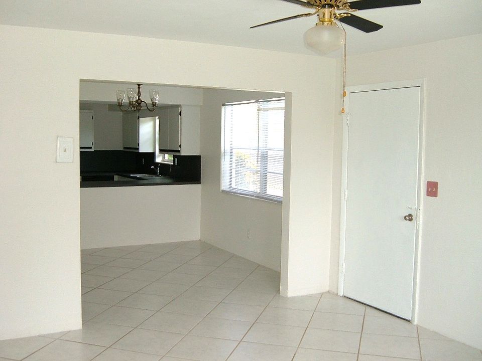 Entrance Door to Living Room, on right is Dining Room and Kitchen.