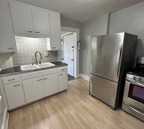 Kitchen with stainless steal appliances, new laminate flooring, freshly painted walls. Plenty of storage.