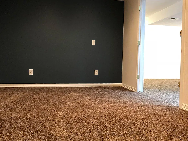 Double door 4th bedroom in basement, very large.