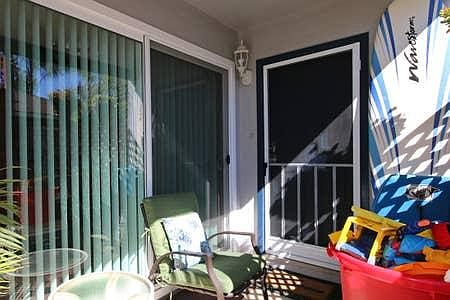 Front door with a front patio sitting area