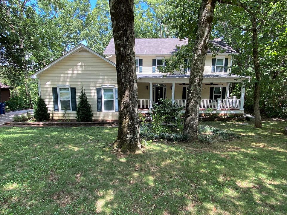 Shady yard with large front porch