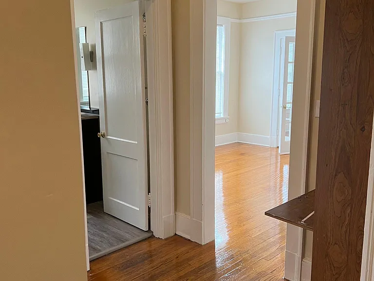 Hallway access to 1st bedroom, bathroom, and den.
