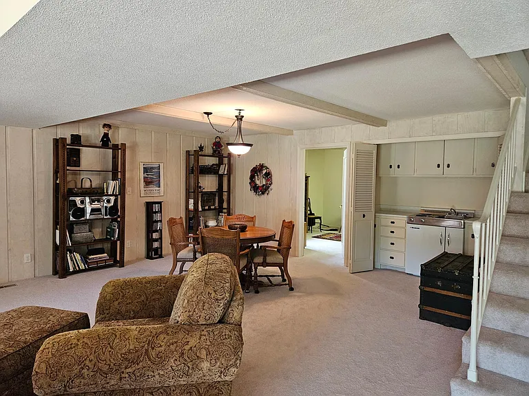 lower level with beamed ceilings & office