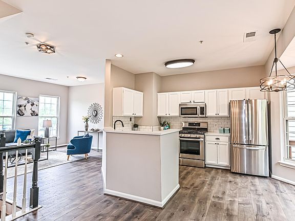 Kitchen Opens to Living Room and Dining Room