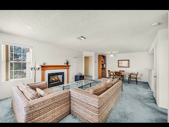 Living Area with fireplace powered by gas.