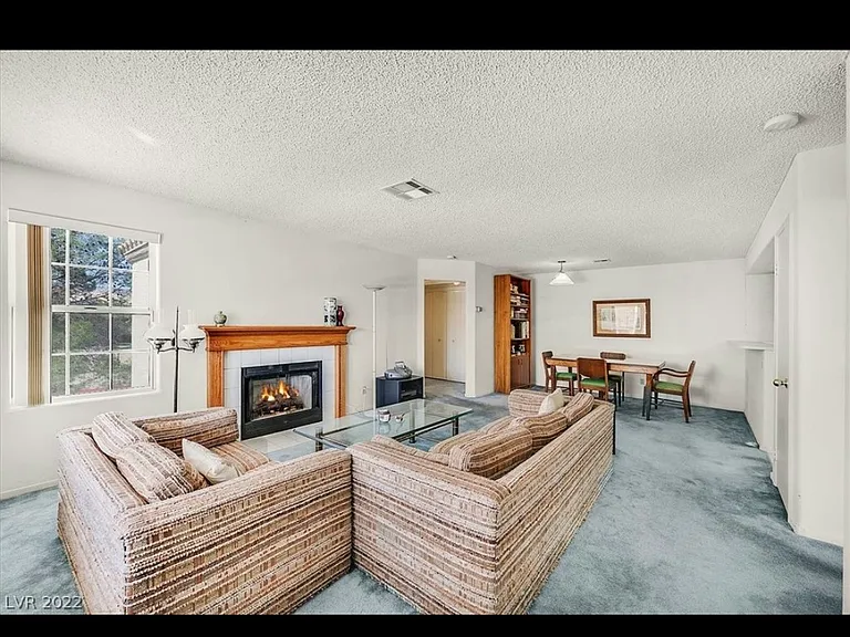 Living Area with fireplace powered by gas.