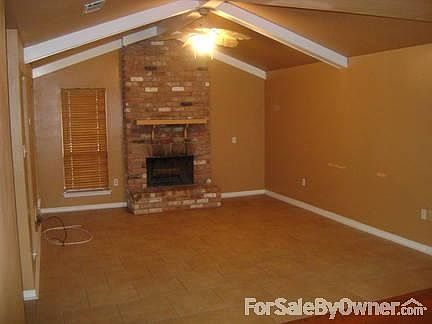 Living room with ceramic tile
						:
						Wood burning fireplace for those cold winter nights.