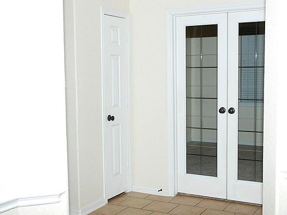 Directly off the foyer is the study which showcase french doors.