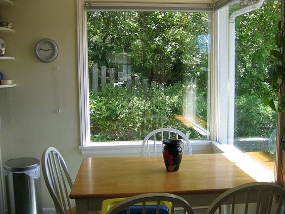 Dining area with view to  wooded lot next doorr