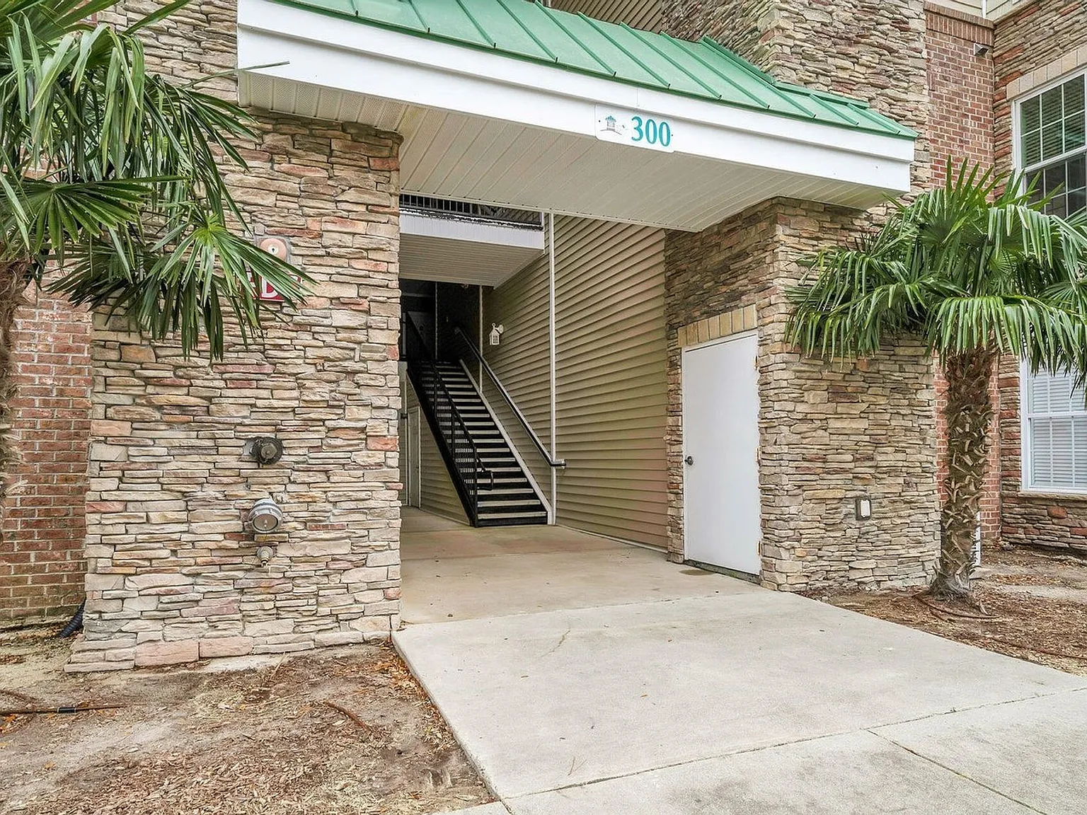 Don't miss this 4-bed, 3-bath condo TWO miles from the ocean! — Photo 1