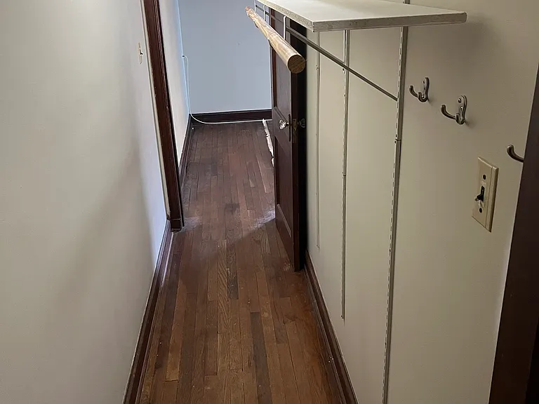 Large closet connects bath/laundry with living room.
