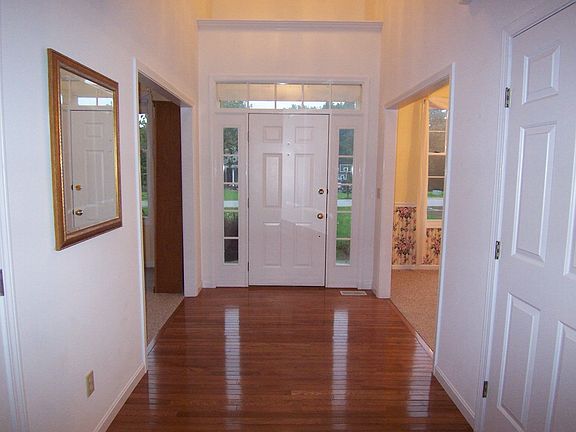 Two story entry with hardwood flooring