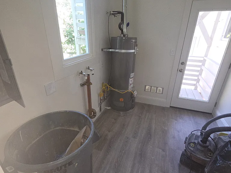 Laundry room before stacked washer and dryer installed
