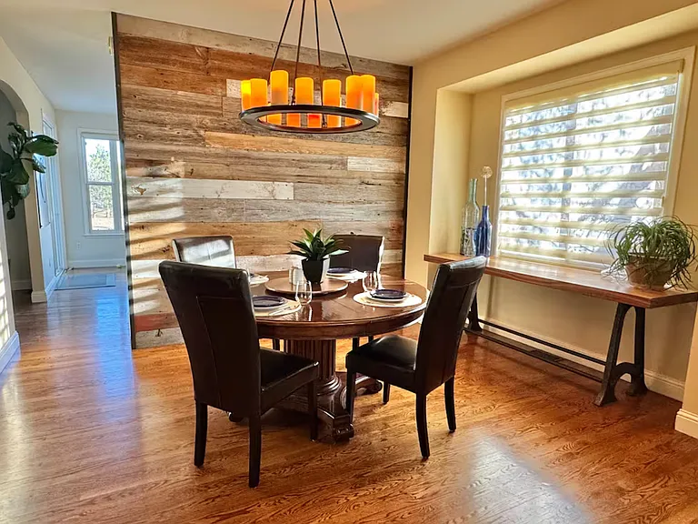 Dinning room with table and chairs to easily seat eight.