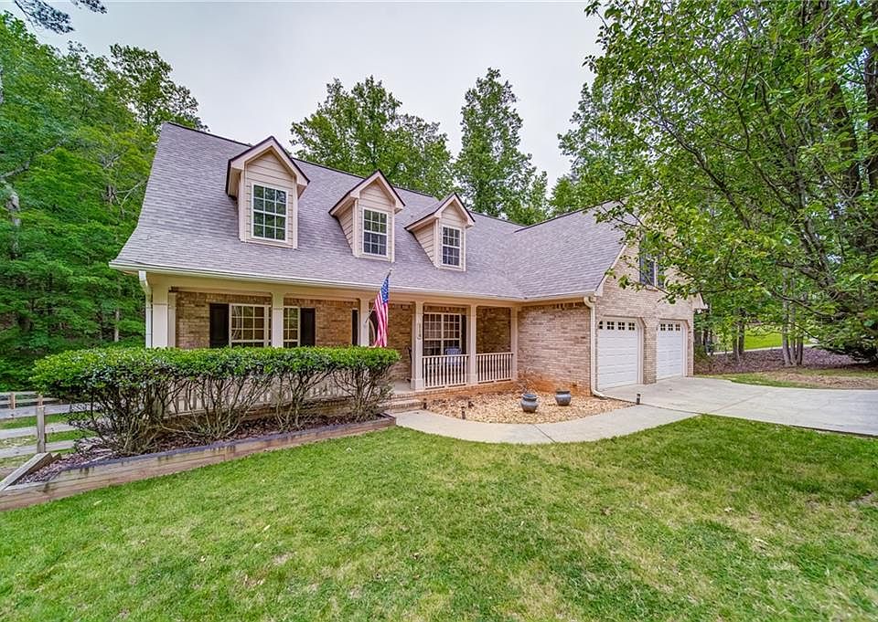 Image 1: Charming Brick Front Cape Cod