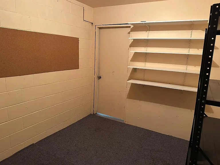 Private storage room adjacent to garage parking.