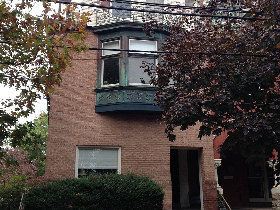 Apartment is on the second floor. Bay window in this picture is the living room of the apartment