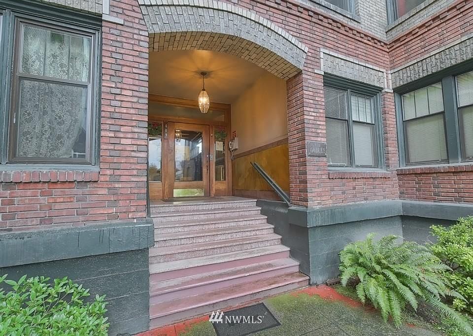 Front porch of historic building with glass door