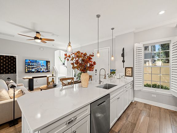 Open concept living space. Kitchen with high-end appliances and finishes.