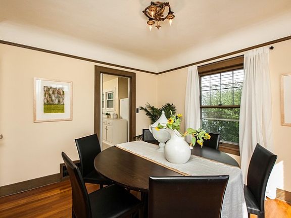 Formal dining room with french doors to living room.