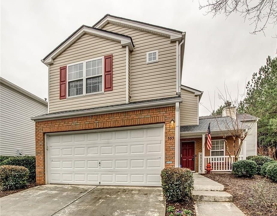 Two car garage single family house sitting at the end of the road that offers more parking spaces
