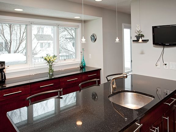Granite counters, cherry cabinets, stainless steel sink