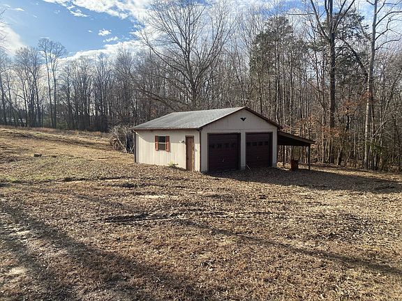 2 car garage with lean to for storage of car, tractor, lawn mower.