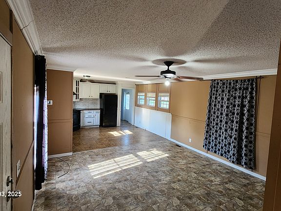 Living Room and Kitchen Facing Back Door